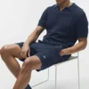 Coastline gebreide polo met korte mouwen - marineblauw