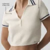 Tennis Club gebreide cropped polo - ivoor/marineblauw